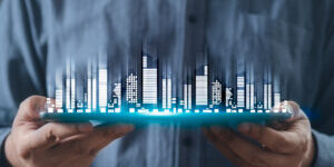 a man hand using digital tablet, and modern buildings hologram. Real estate business and building technology concept. hand holding an empty digital tablet with Smart city with smart services